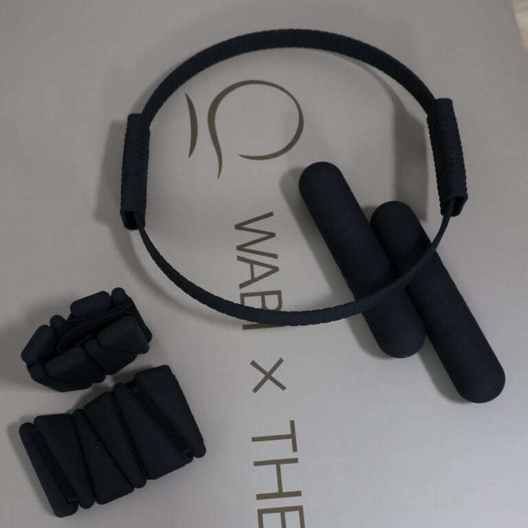 Black pilates accessories set on a milk tea oval mat  branding.